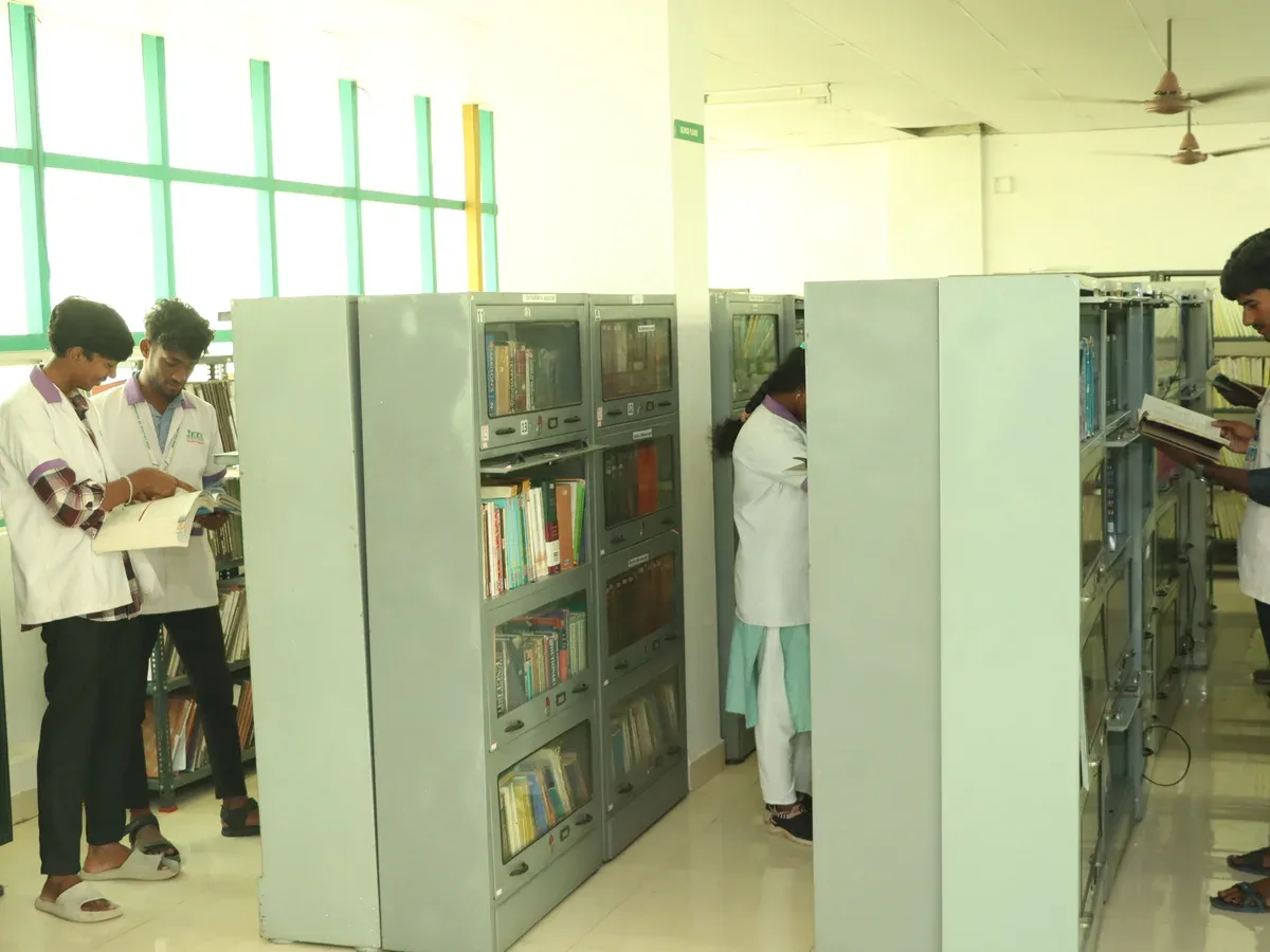 Learners browsing books in the JKKN College of Pharmacy Library