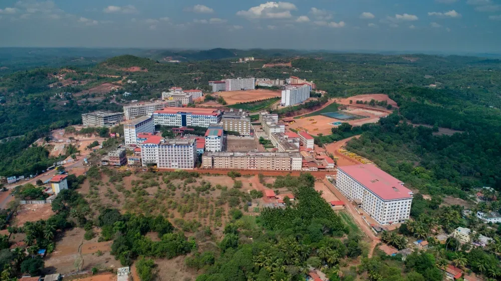 Broad aerial view of Alva's campus amid greenery — Alva's College of Nursing