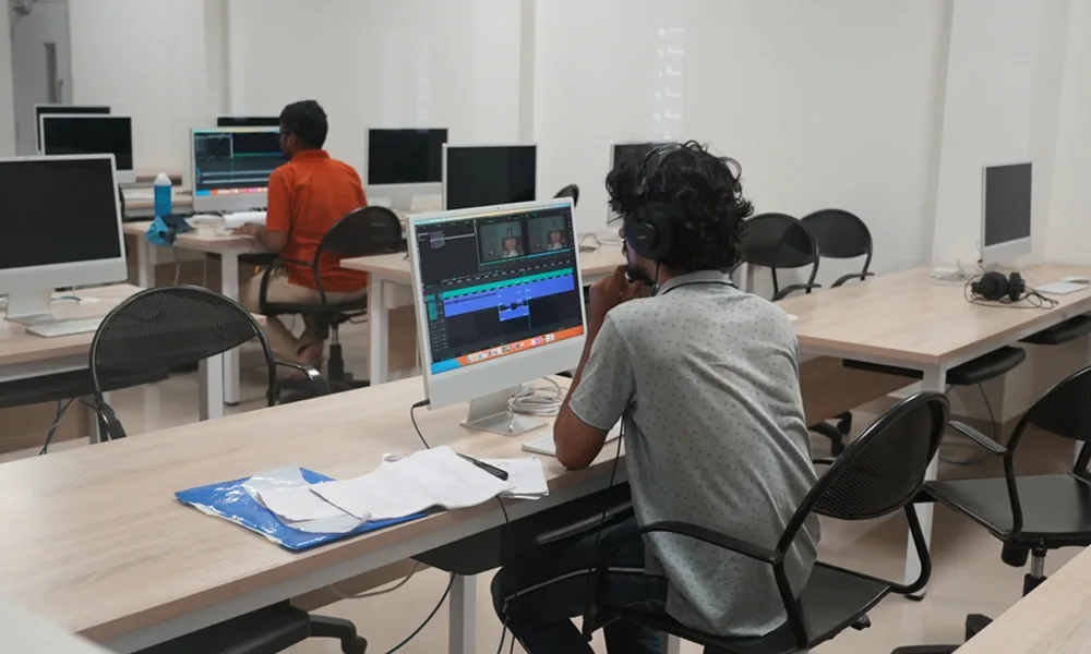 Student mastering editing tools in the Digital Editing Lab. — L.V. Prasad College of Media Studies