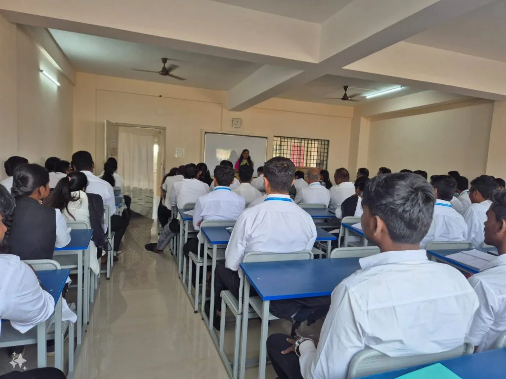 A group of students sitting as there is a teacher in front of them — Panchami College of Law