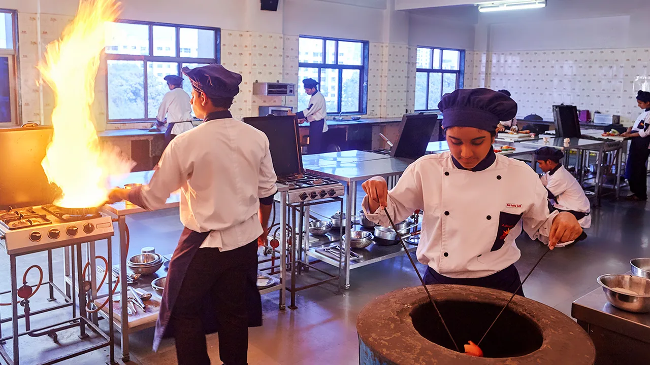Students flambéing — Sai Shiva Educational Trust's Arun Muchhala International College of Hotel Management