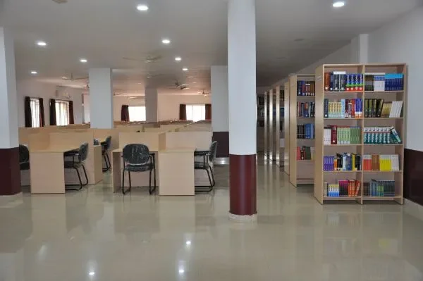 Library reading hall with study desks and medical bookshelves at Kanachur Institute of Medical Sciences