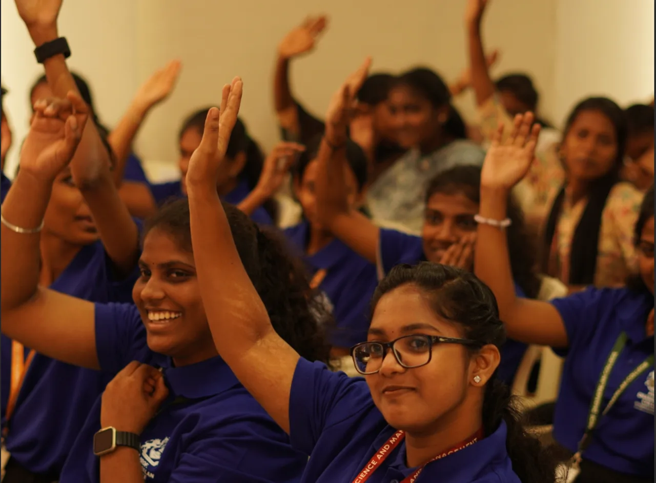 Students attending a lecture at Prof. Dhanapalan College