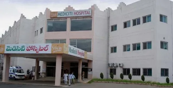 MediCiti Hospital building on the Ghanpur campus with its Telugu and English signage