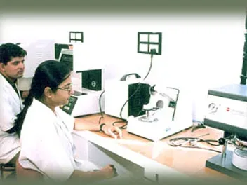 Technicians at work in a clinical laboratory of Al-Ameen Medical College