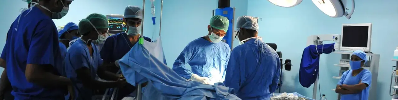 Surgical team at work in an operation theatre at Srinivas Hospital, Mukka