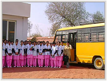Sofia College of Nursing — Gallery Page Campus Activity Image Showing Students Beside A Bus At A Campus Building