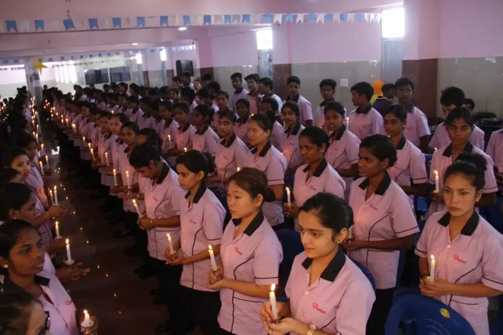 Nursing students participating in a candle-lighting ceremony — Bethel Medical Institute of Nursing Sciences