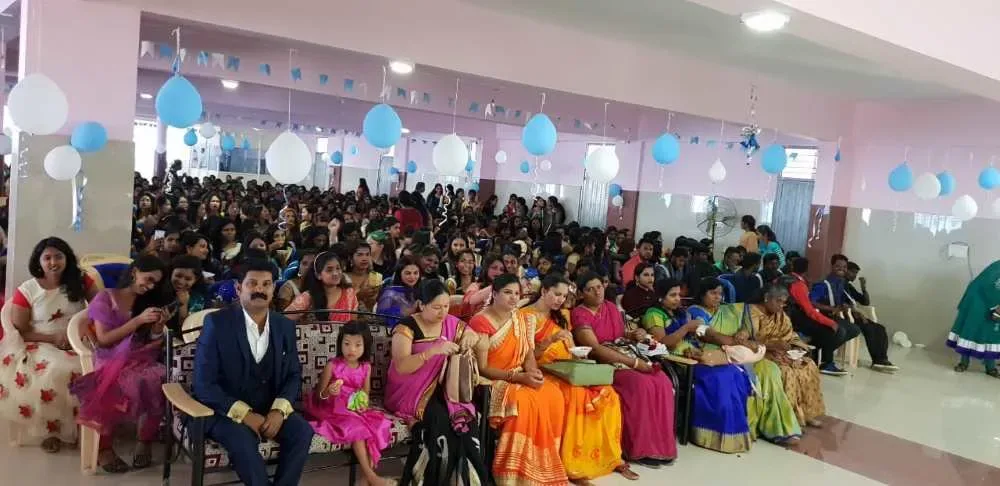 Official indoor college ceremony with a large audience — Bethel Medical Institute of Nursing Sciences