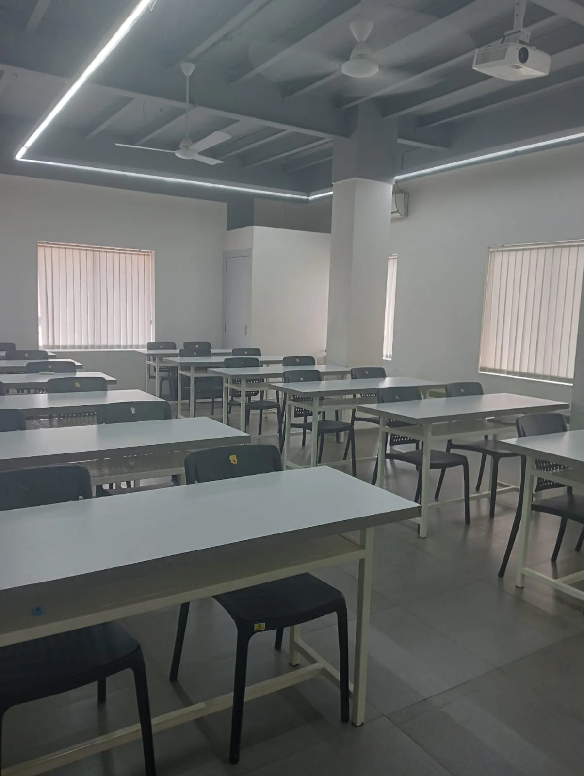 Students studying in open-air courtyard — NIF Global South Mumbai