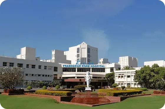 KLES Dr. Prabhakar Kore Hospital & Medical Research Centre building with lawns in Belagavi, the teaching hospital of Jawaharlal Nehru Medical College