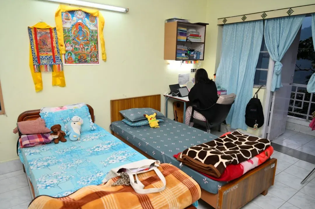 Student hostel room with beds and study furniture — Sikkim Manipal College of Nursing