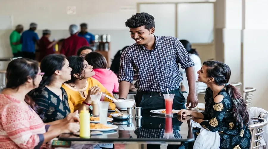 Students having lunch in the campus cafeteria at K S Hegde Medical Academy, Mangalore