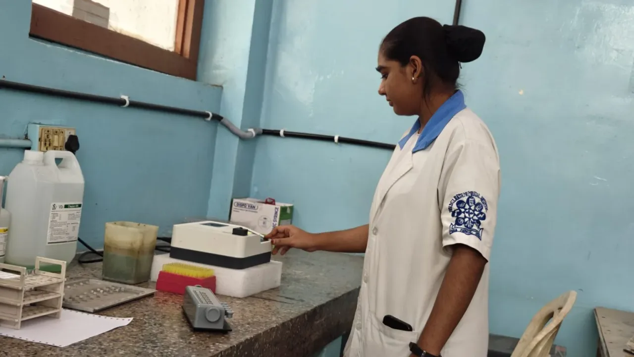 Laboratory professional operating clinical testing equipment — C.S.I. Holdsworth Memorial Hospital College of Nursing