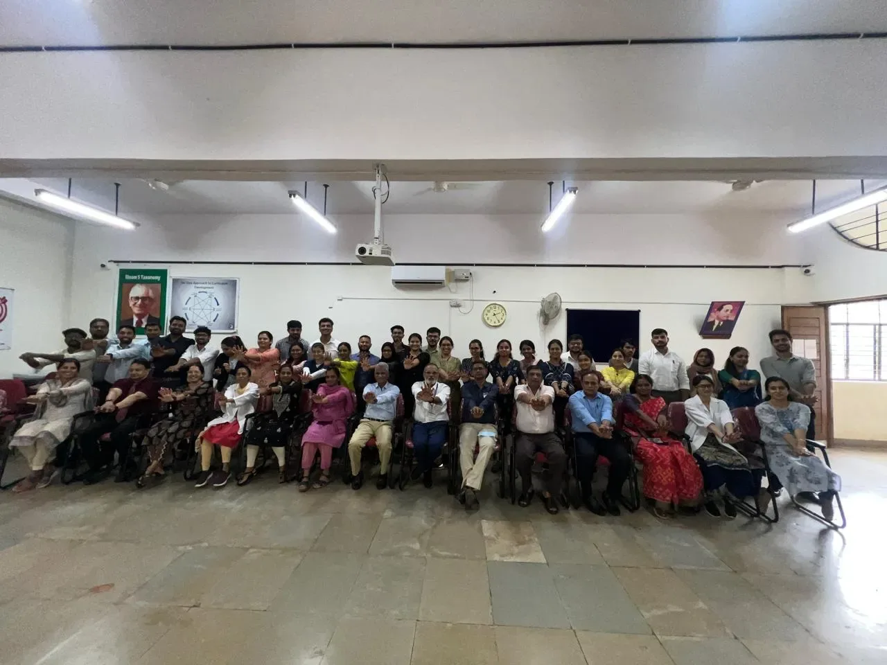 Faculty members at a curriculum development workshop in a seminar room, Dr. B.R. Ambedkar Medical College, Bengaluru