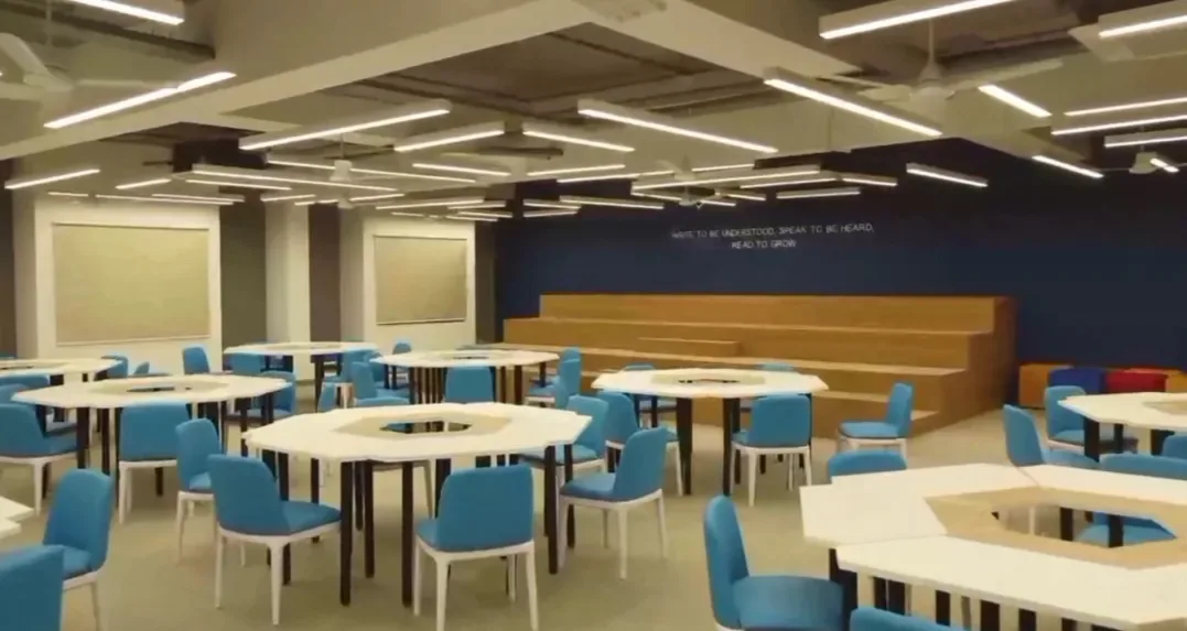 Activity-based learning room with hexagonal tables and tiered seating at Datta Meghe Medical College, Nagpur