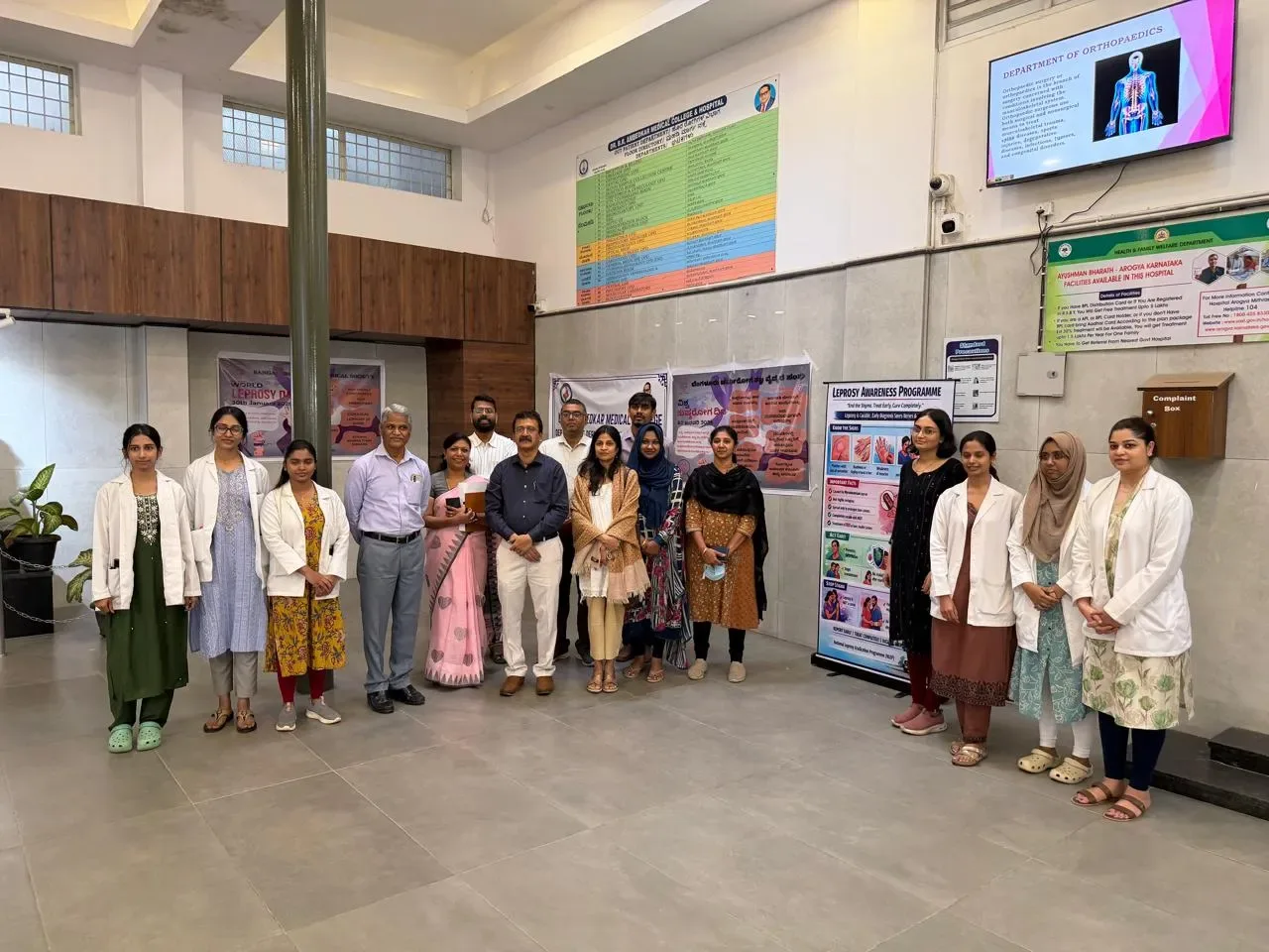 Staff and students at a health awareness programme in the hospital lobby, Dr. B.R. Ambedkar Medical College & Hospital, Bengaluru