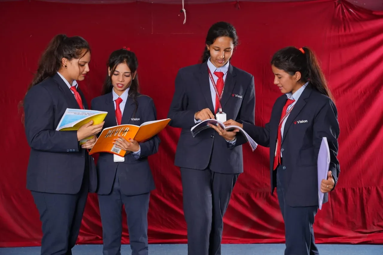 A library filled with books and students studying — Vision Degree College