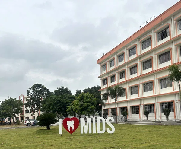 Meghna Institute of Dental Sciences — Official Infrastructure Gallery Image Showing Campus Lawn And Academic Building