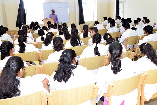 MBBS students in white coats attending a lecture at S S Institute of Medical Sciences & Research Centre, Davangere