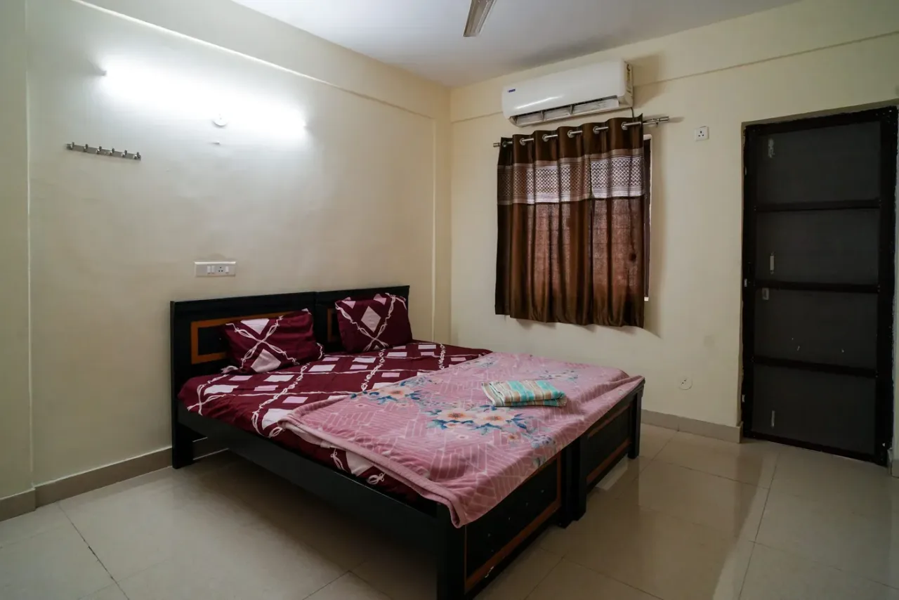 Air-conditioned twin-bed room in the girls' hostel at Mamata Academy of Medical Sciences