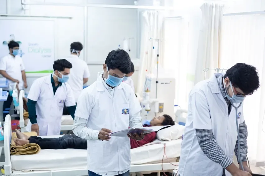 Nursing trainees practicing patient care in a clinical skills lab — Parul Institute of Nursing