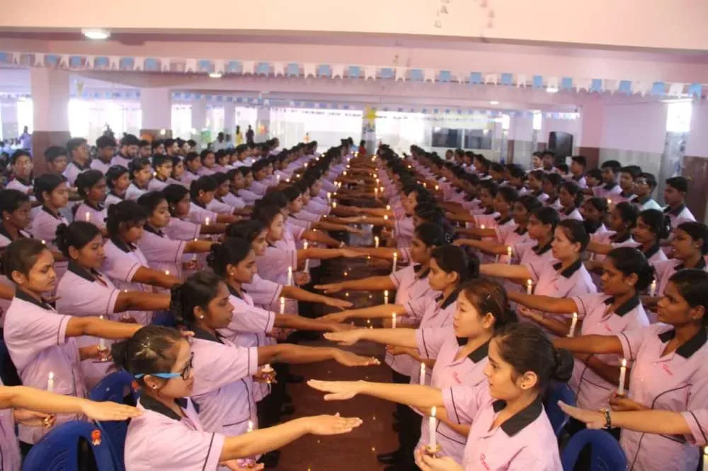 Large gathering of uniformed nursing students at a ceremony — Bethel Medical Institute of Nursing Sciences