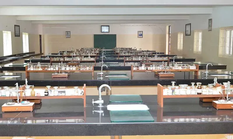 Rows of laboratory benches with reagent racks in a practical hall at S S Institute of Medical Sciences, Davangere