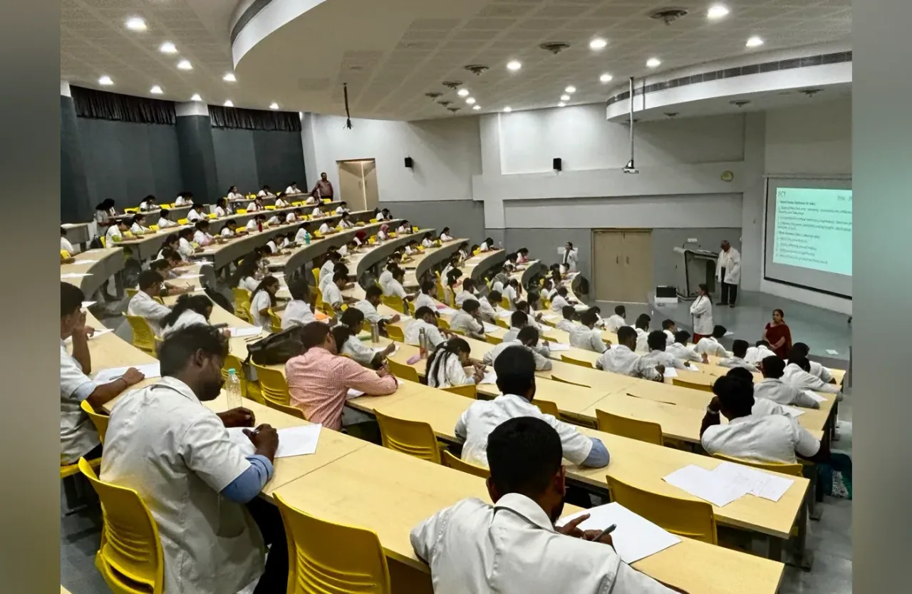 MBBS students attending a lecture in a gallery-style lecture theatre at SSIMSRC