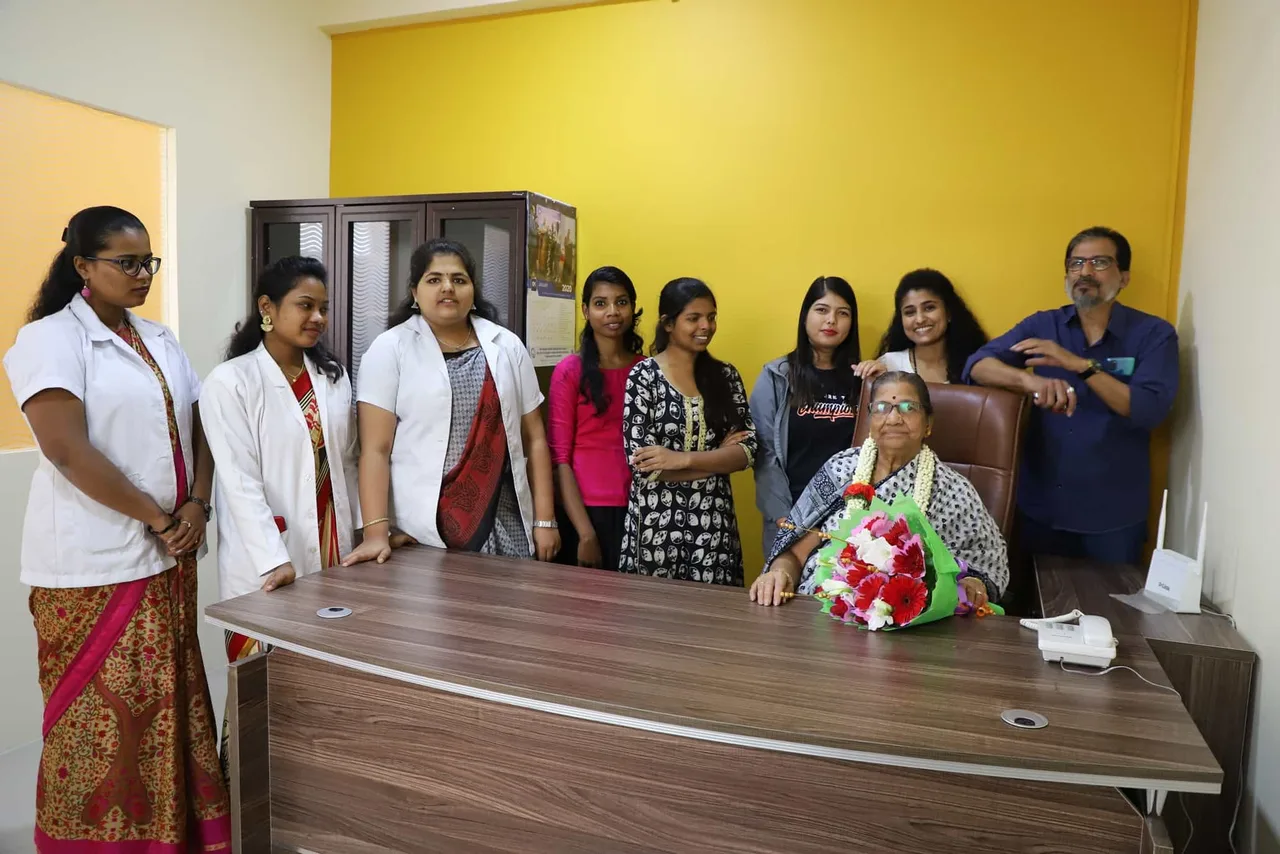 Students wearing new white coats with faculty mentors — dmj-institute-of-nursing-science-bengaluru