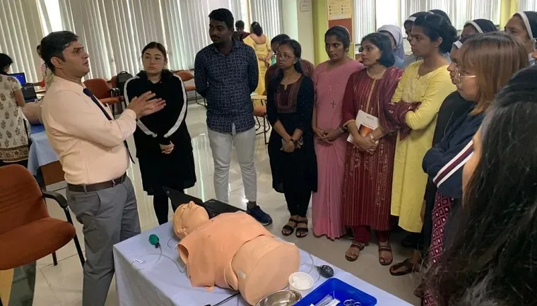 Nursing participants practicing with a medical training mannequin — Manipal College of Nursing (MCON), Manipal Academy of Higher Education