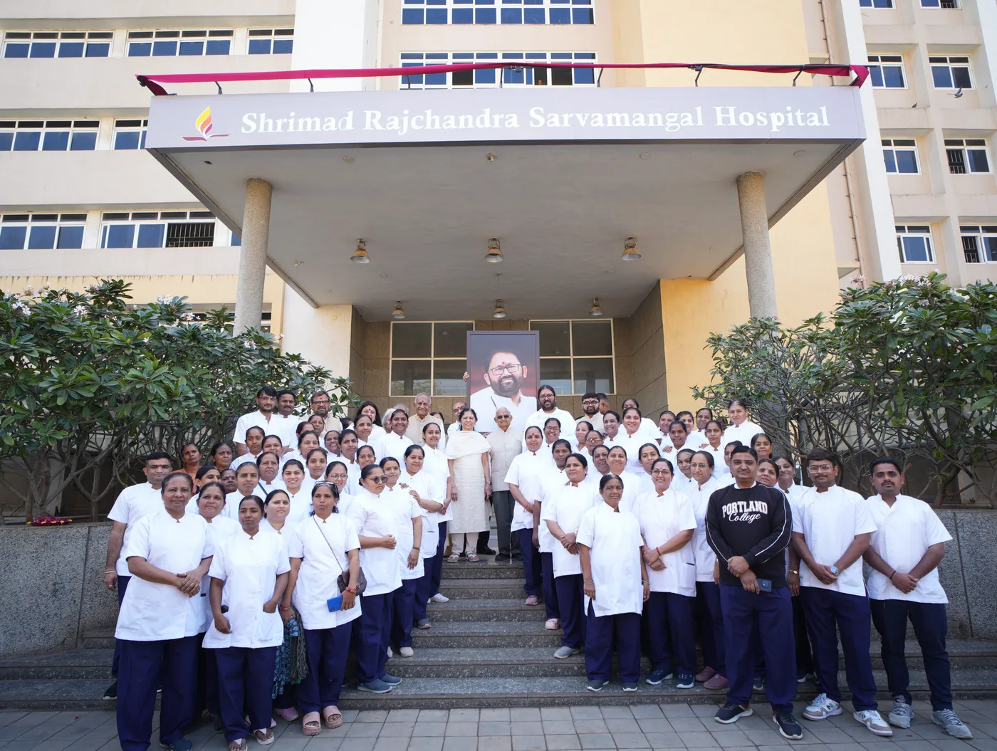 Nursing and hospital staff of the Shrimad Rajchandra Sarvamangal Hospital, C. U. Shah Medical College, on the hospital steps