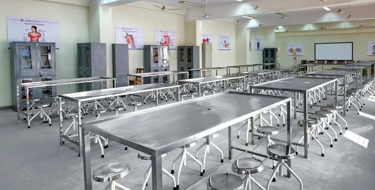 Anatomy dissection hall with stainless-steel dissection tables at Dr. Kiran C. Patel Medical College, Bharuch