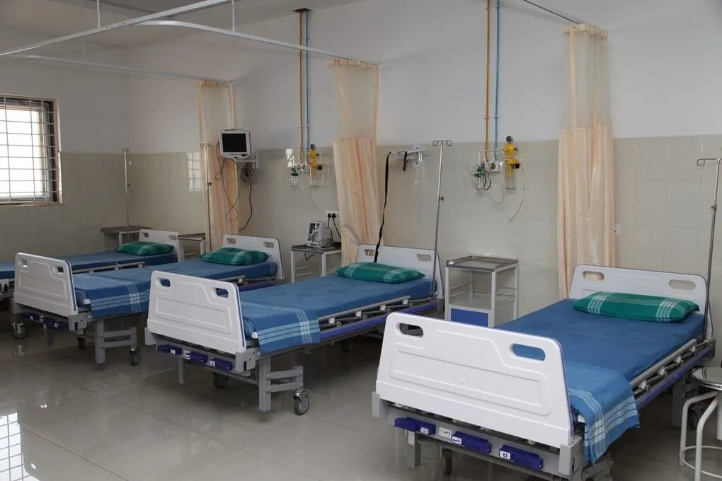 General ward with hospital beds and bedside monitors at East Point Hospital, Bengaluru