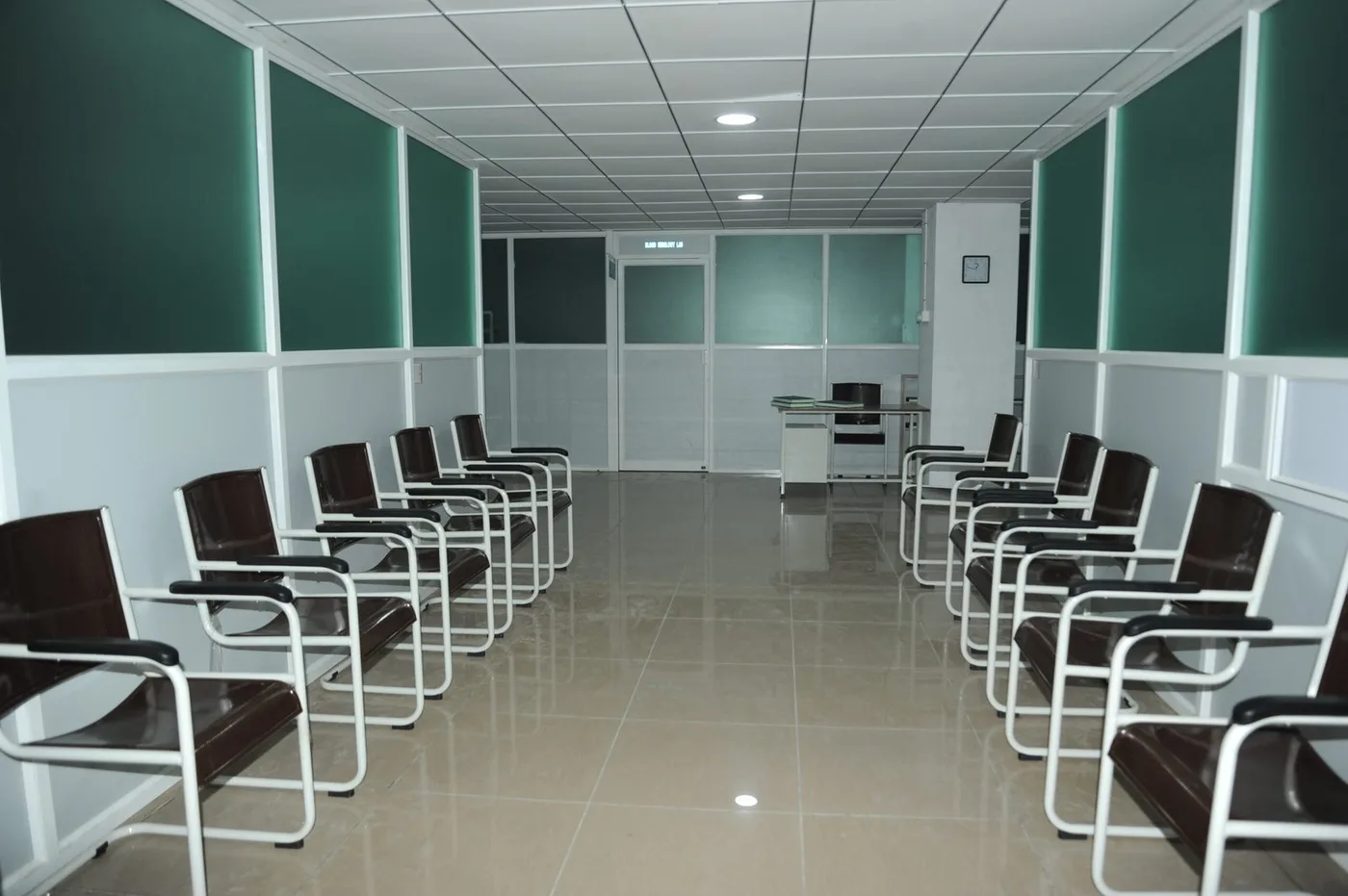 Outpatient department waiting area with rows of seating at Indira Medical College & Hospitals, Pandur