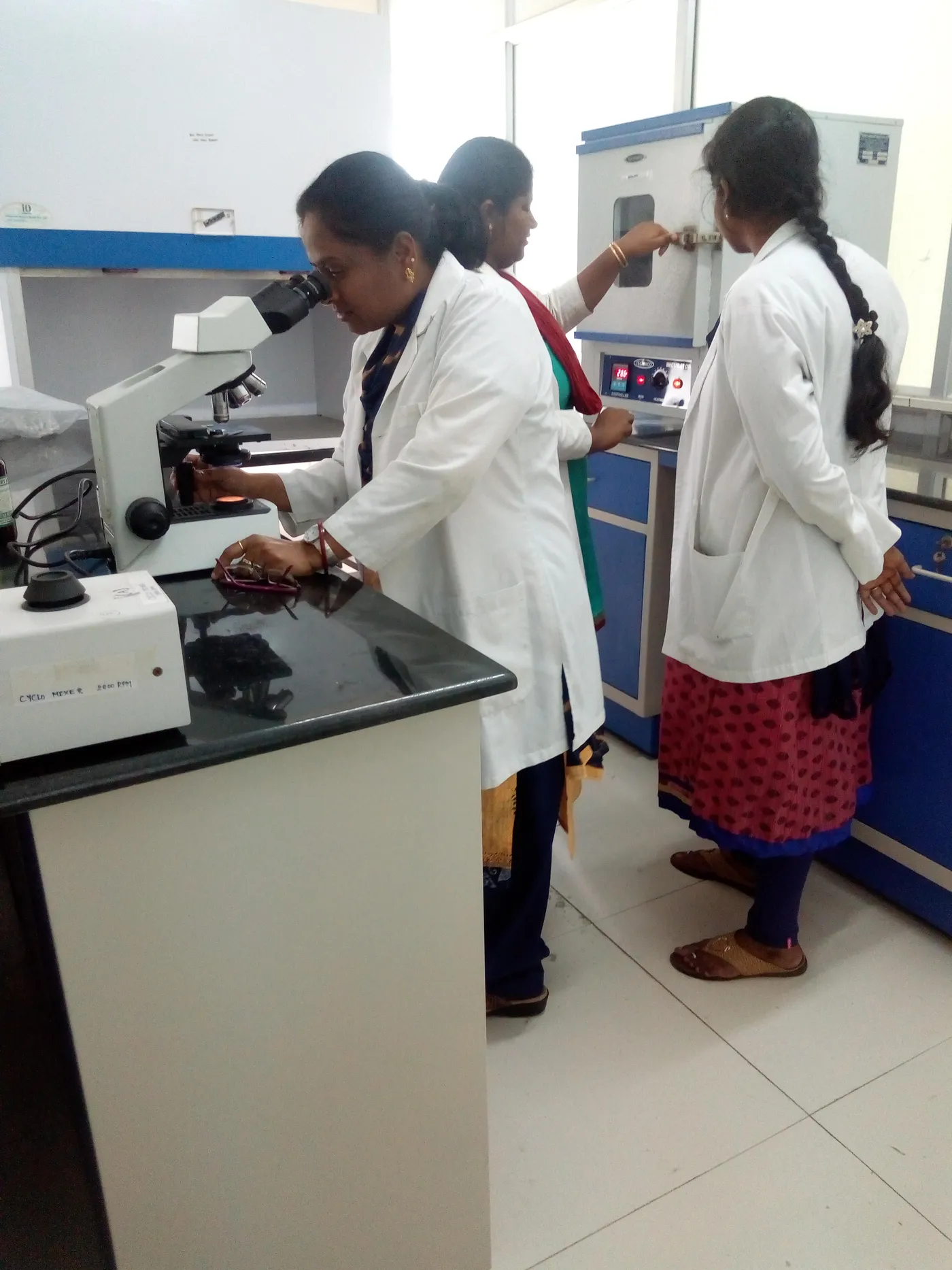 Students at laboratory benches with microscopes in a teaching laboratory at Karpaga Vinayaga Institute of Medical Sciences