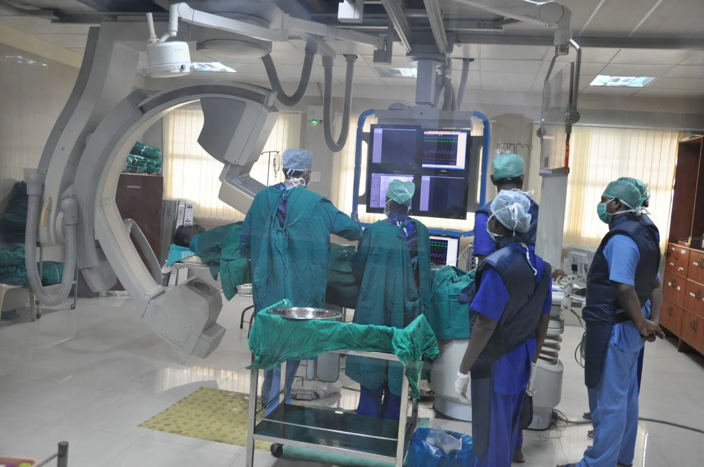Surgical team at the cardiac catheterisation / C-arm suite of Meenakshi Medical College Hospital, Kanchipuram