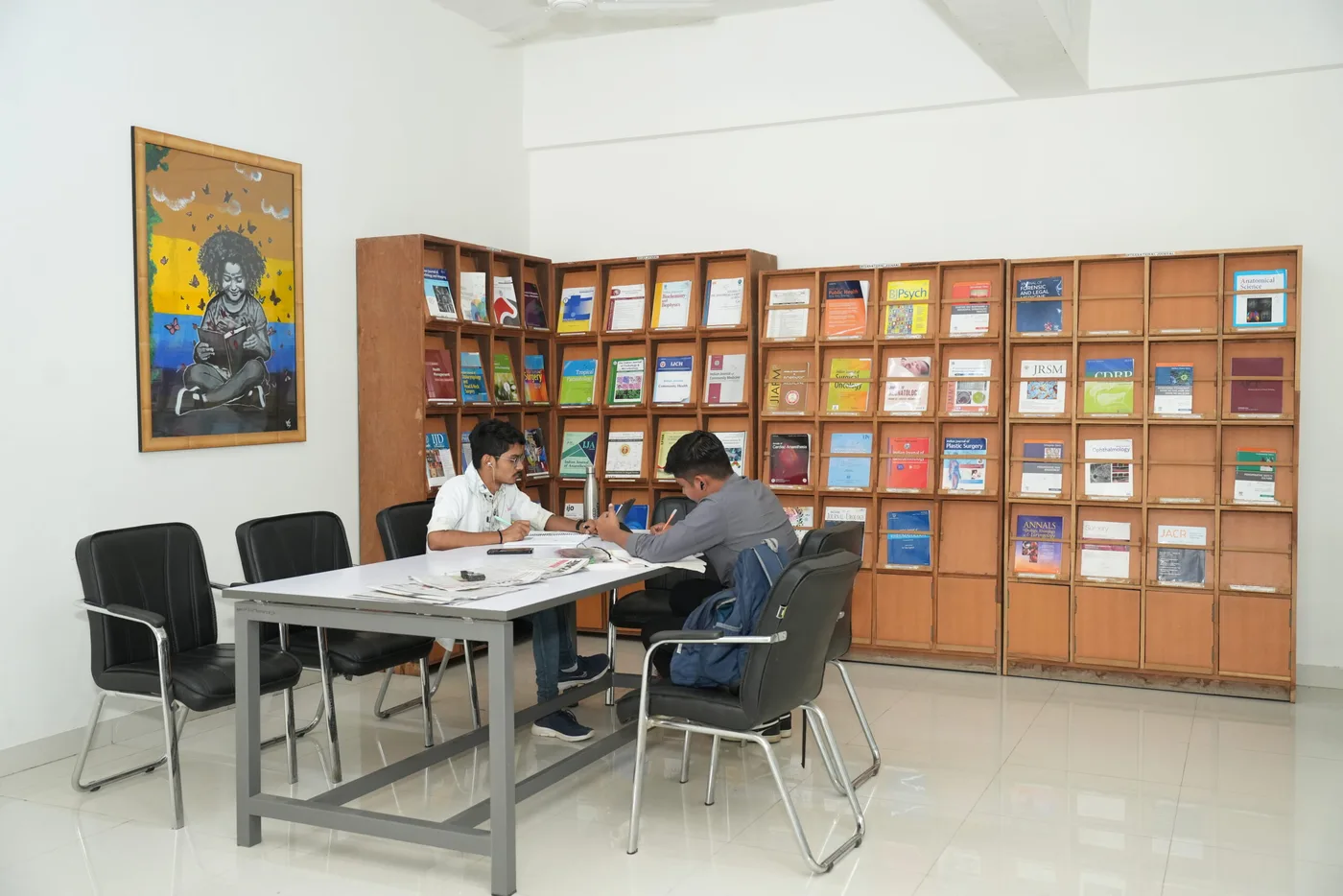 Students reading at the journal and reference section of the Nootan Medical College library, Visnagar