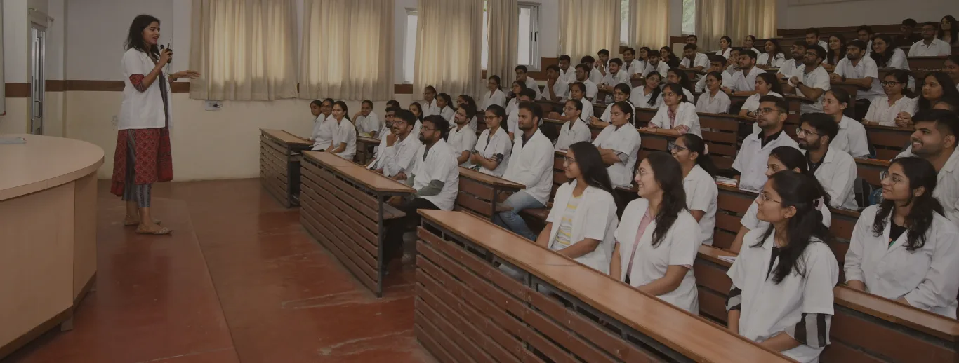Pramukhswami Medical College students gathered in the college auditorium during an academic session