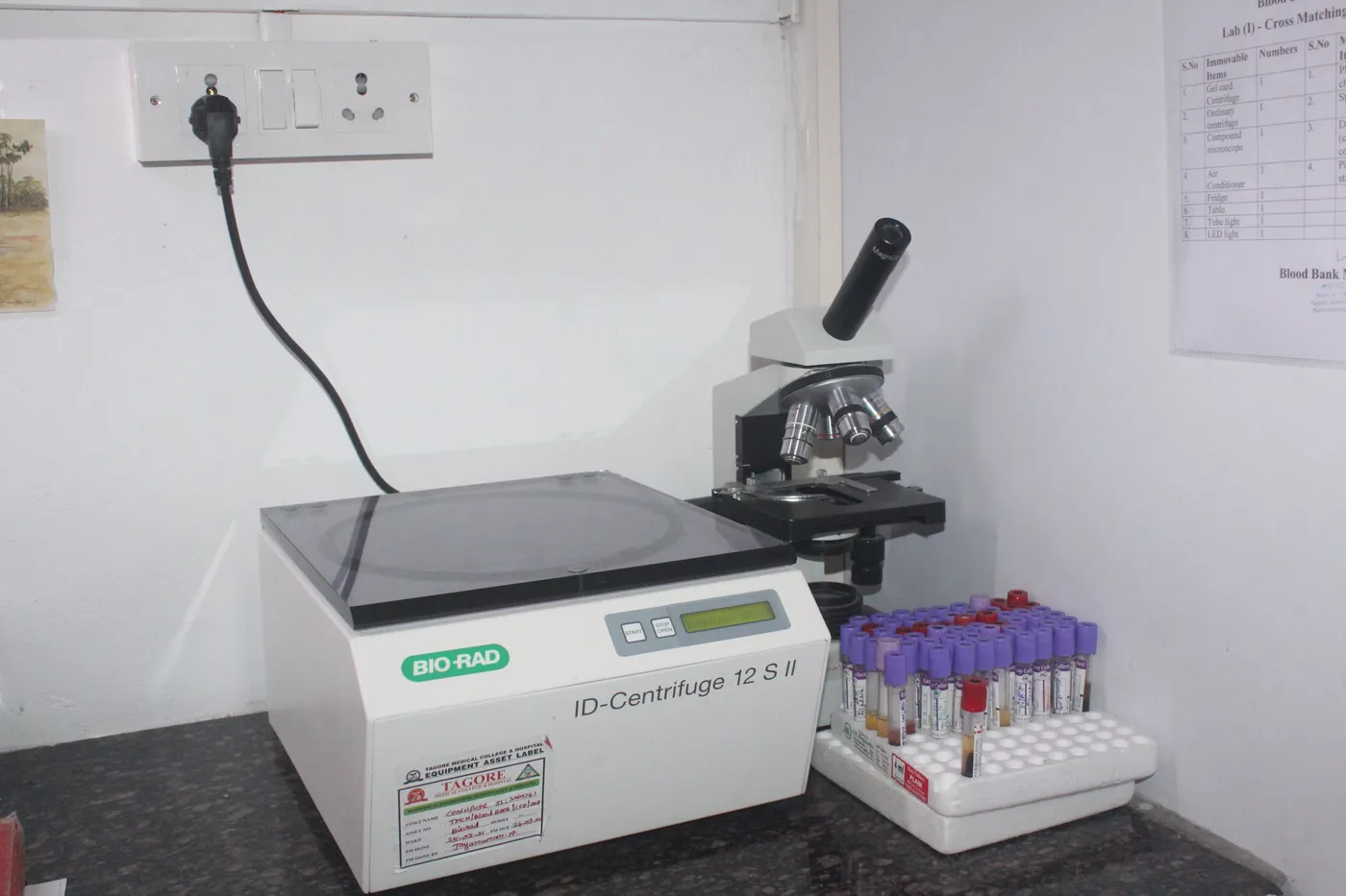Blood-bank cross-matching bench with an ID-centrifuge and microscope at Tagore Medical College and Hospital