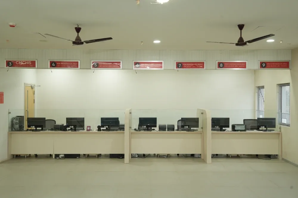Numbered registration counters including CMCHIS and new-registration desks at Takshashila Medical College Hospital