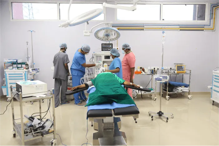 Operation theatre at VELS Hospital with surgical team and a draped patient